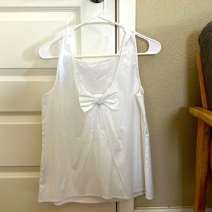 Sleeveless cotton blouse with bow detail in back